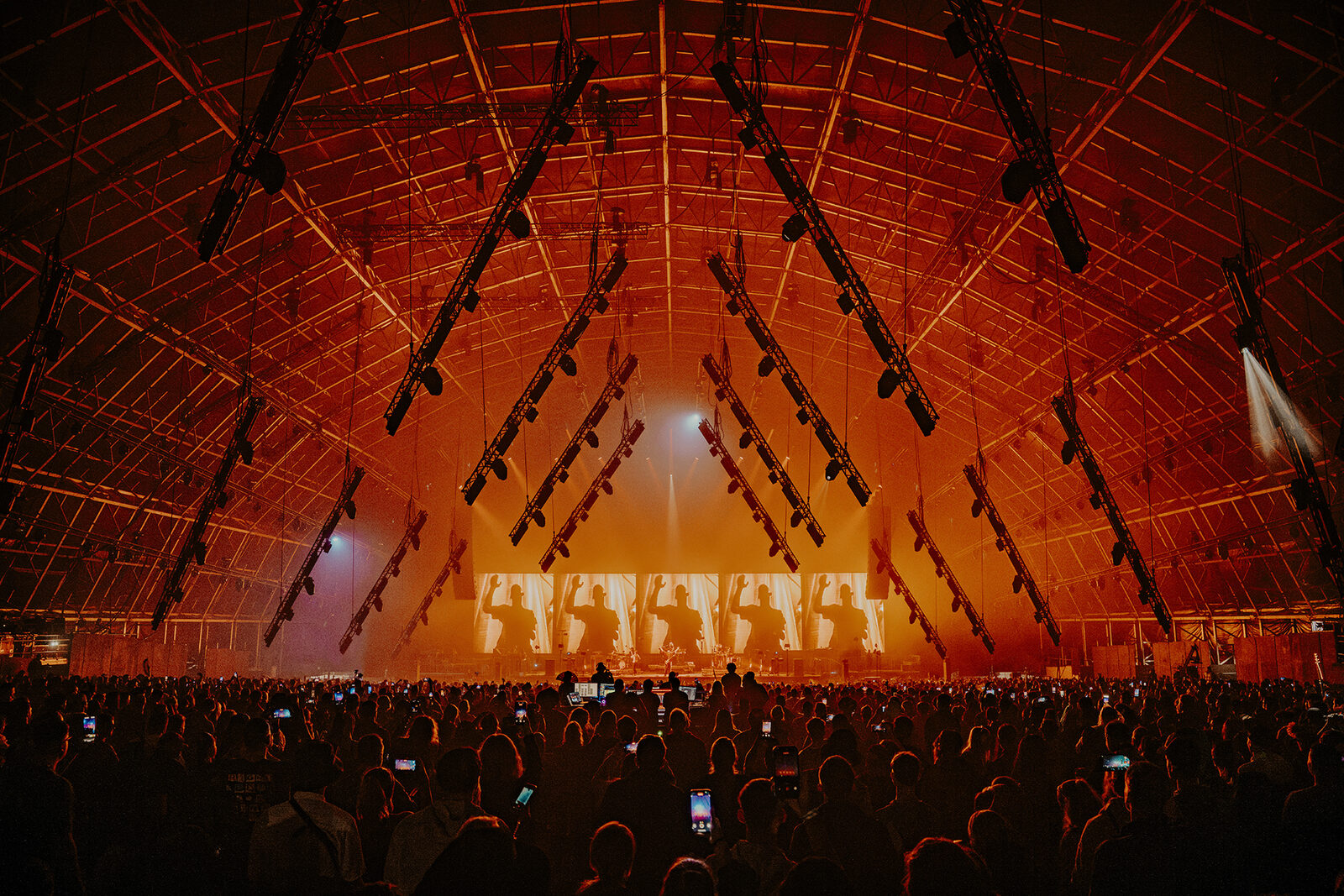 Wide view of the tent with orange stage glow, Faithless at Creamfields 2026