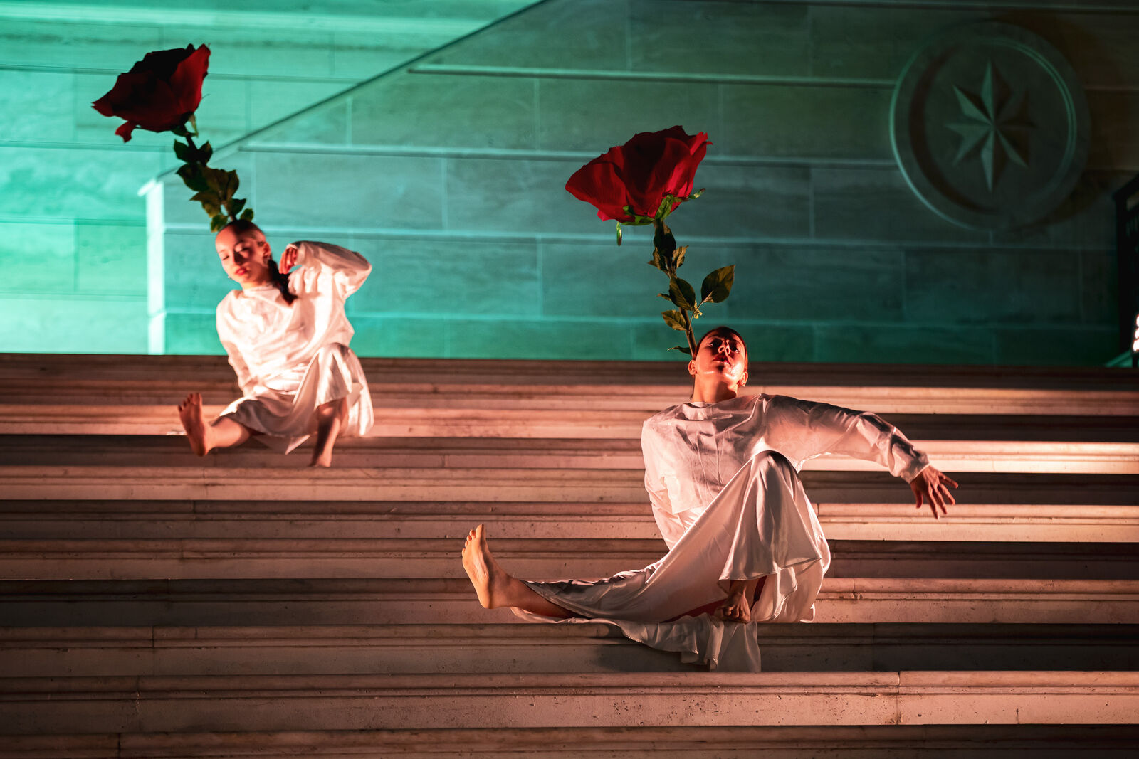 Dancers with roses on the steps